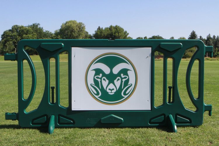 Green barrier on grass with rams head logo inset