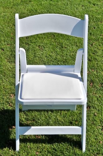 White Folding Chair On Grass